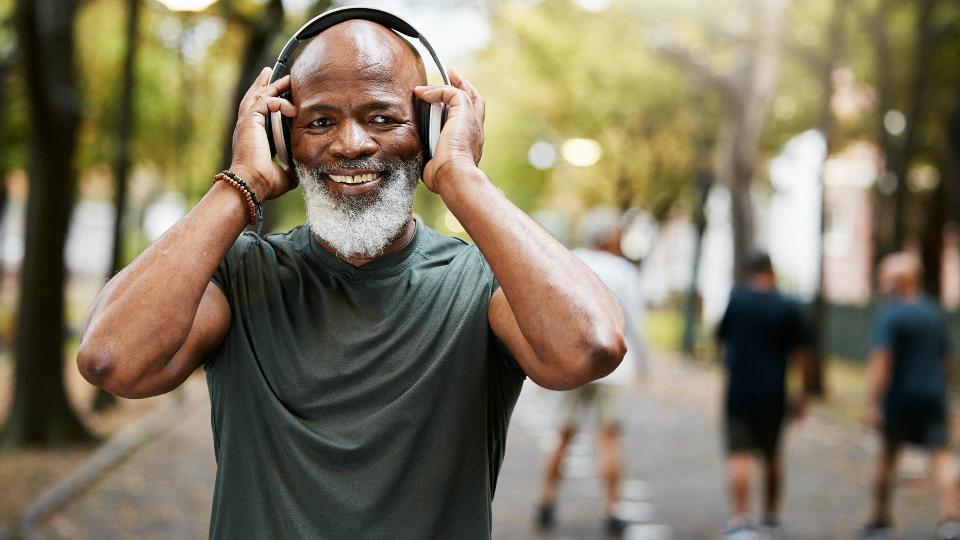 Happy older person wears headphones showing they choose themselves