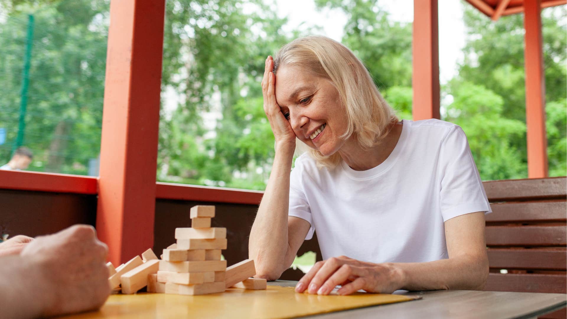 older person collapsed jenga game showing happy mistakes