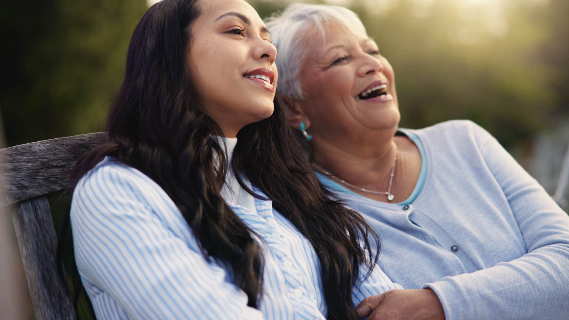 older person communicates with happy younger person showing commonality