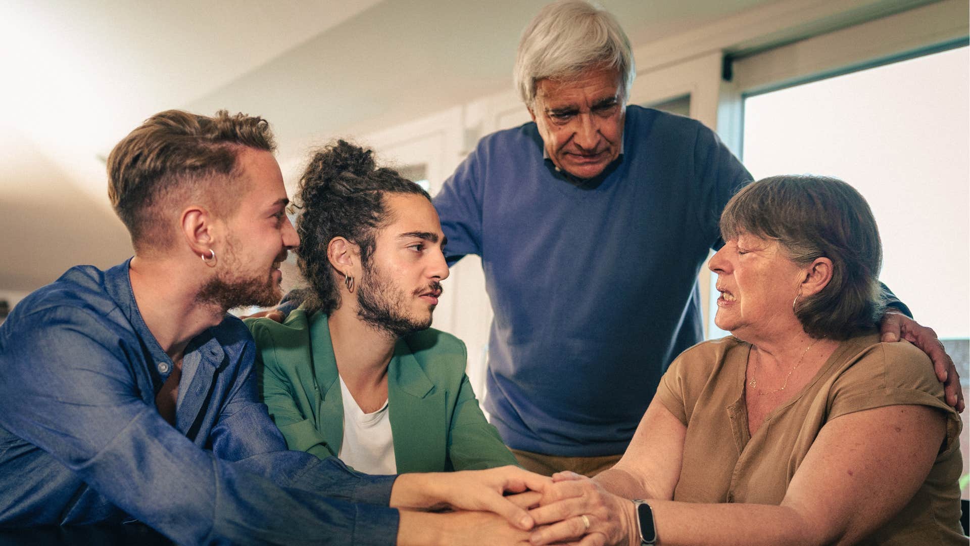 younger couple communicates with empathetic older couple showing consistency