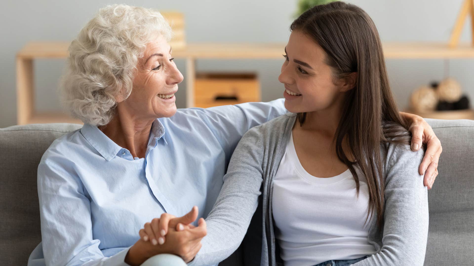 older person communicates with relaxed younger person 
