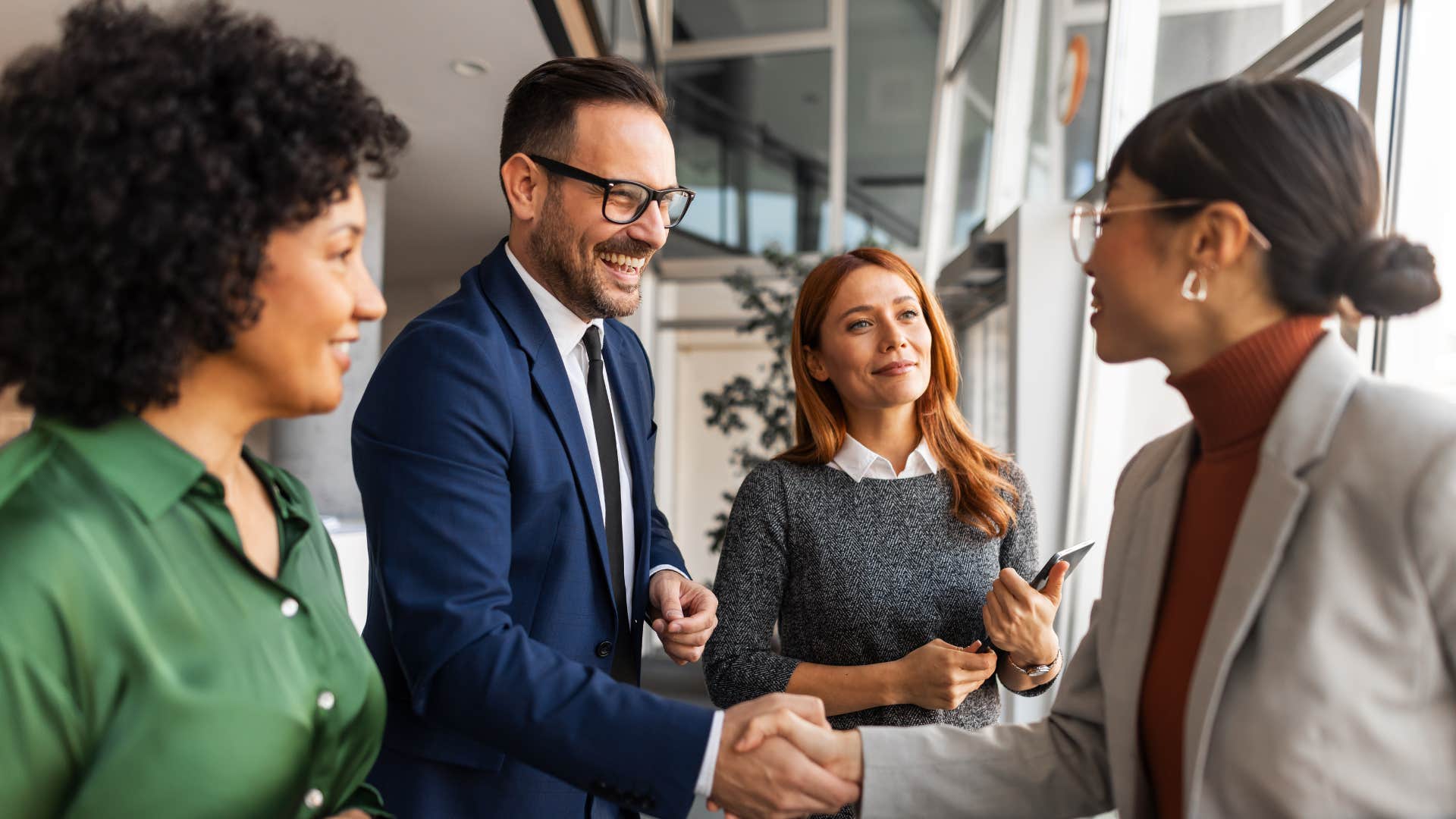 man shaking colleague's hand saying thank you for being here