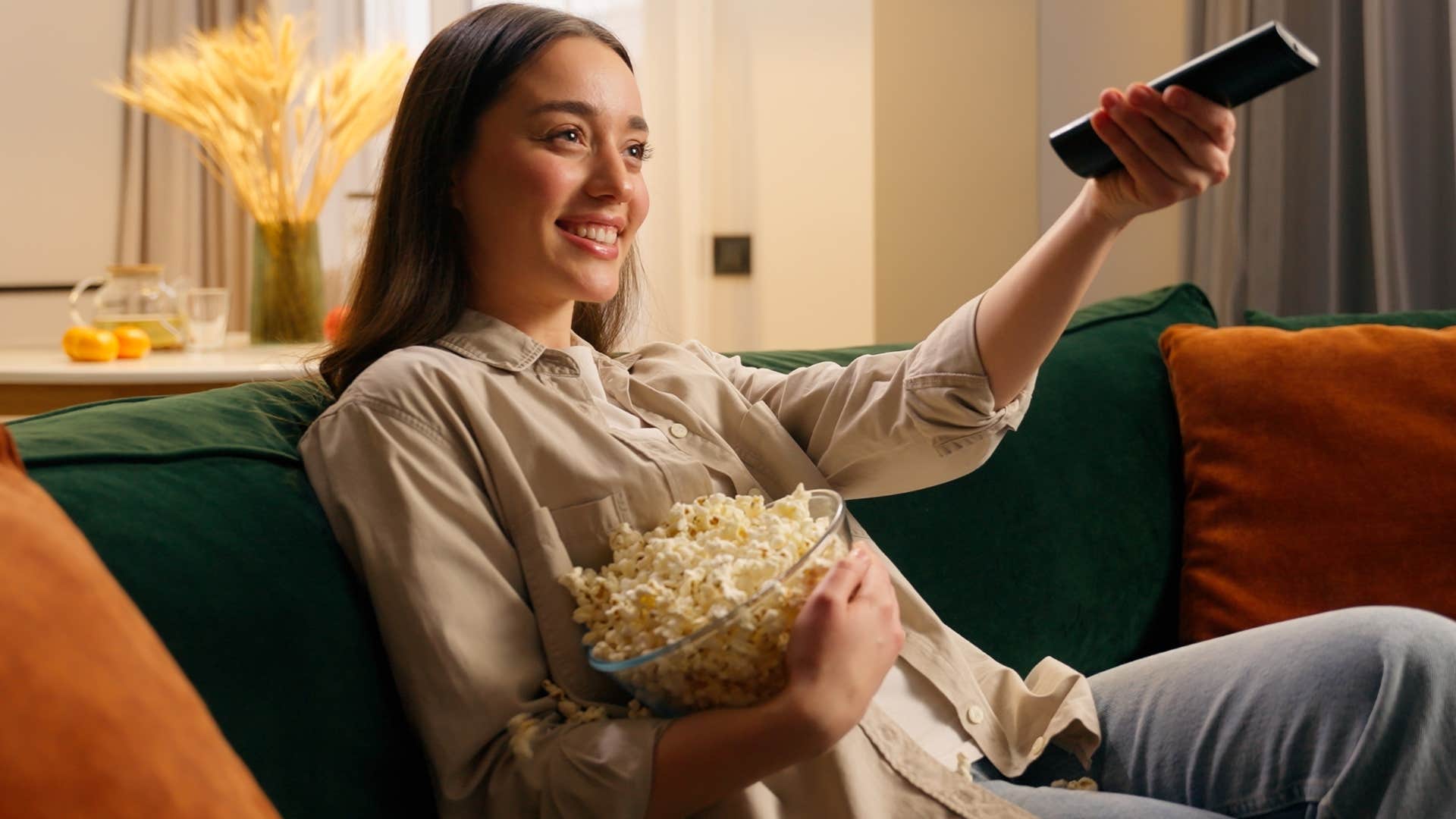 woman who protects their energy sitting at home watching tv