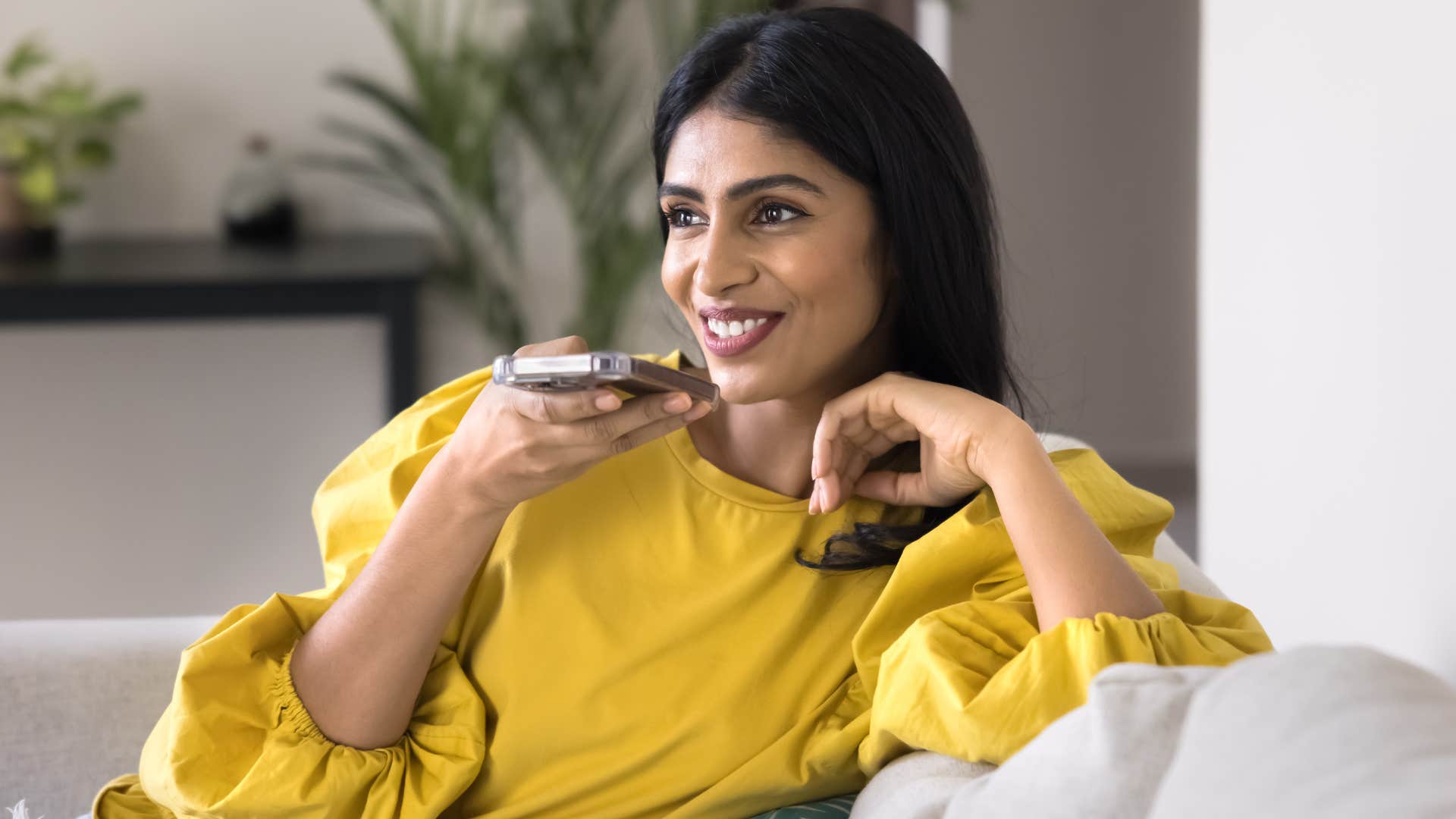 woman who refuses to overexplain herself talking on speakerphone