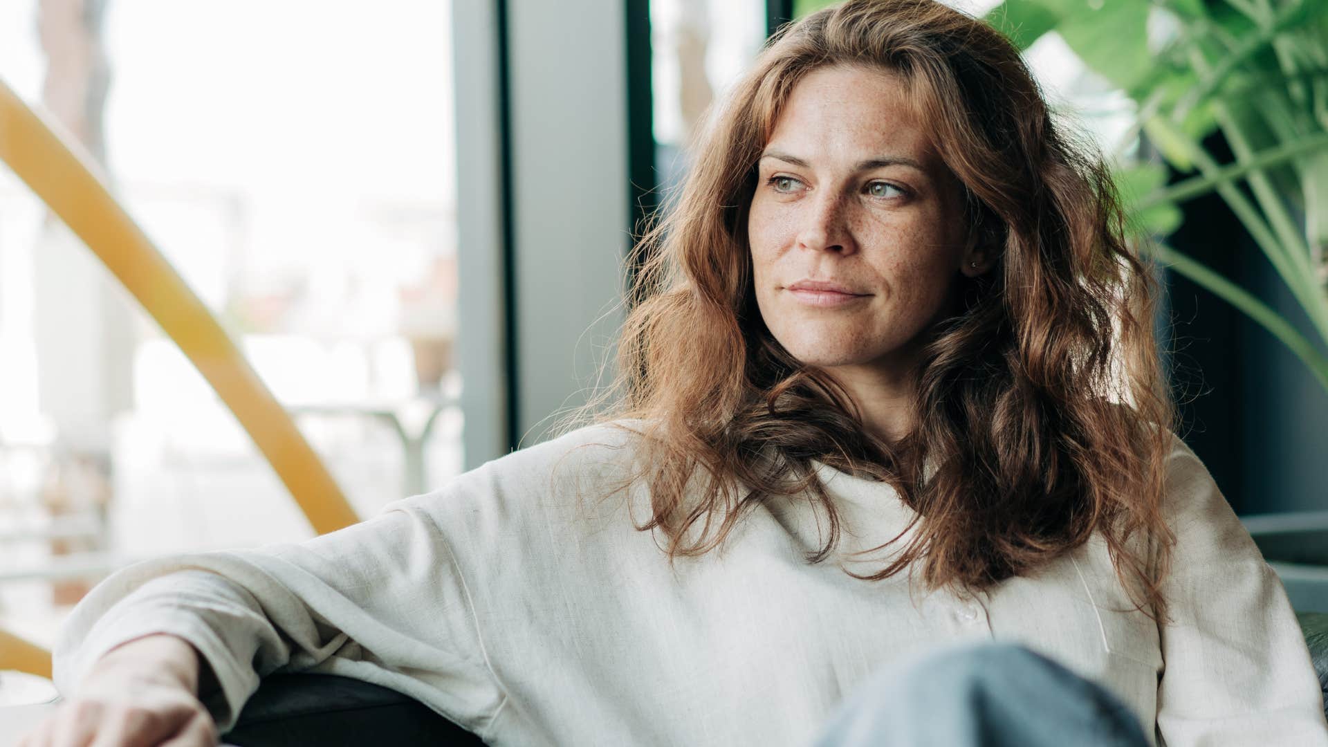 woman who regulates her emotions sitting at home