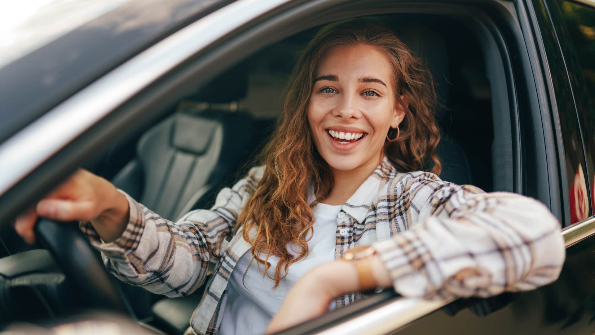 woman who genuinely cares about others driving a car