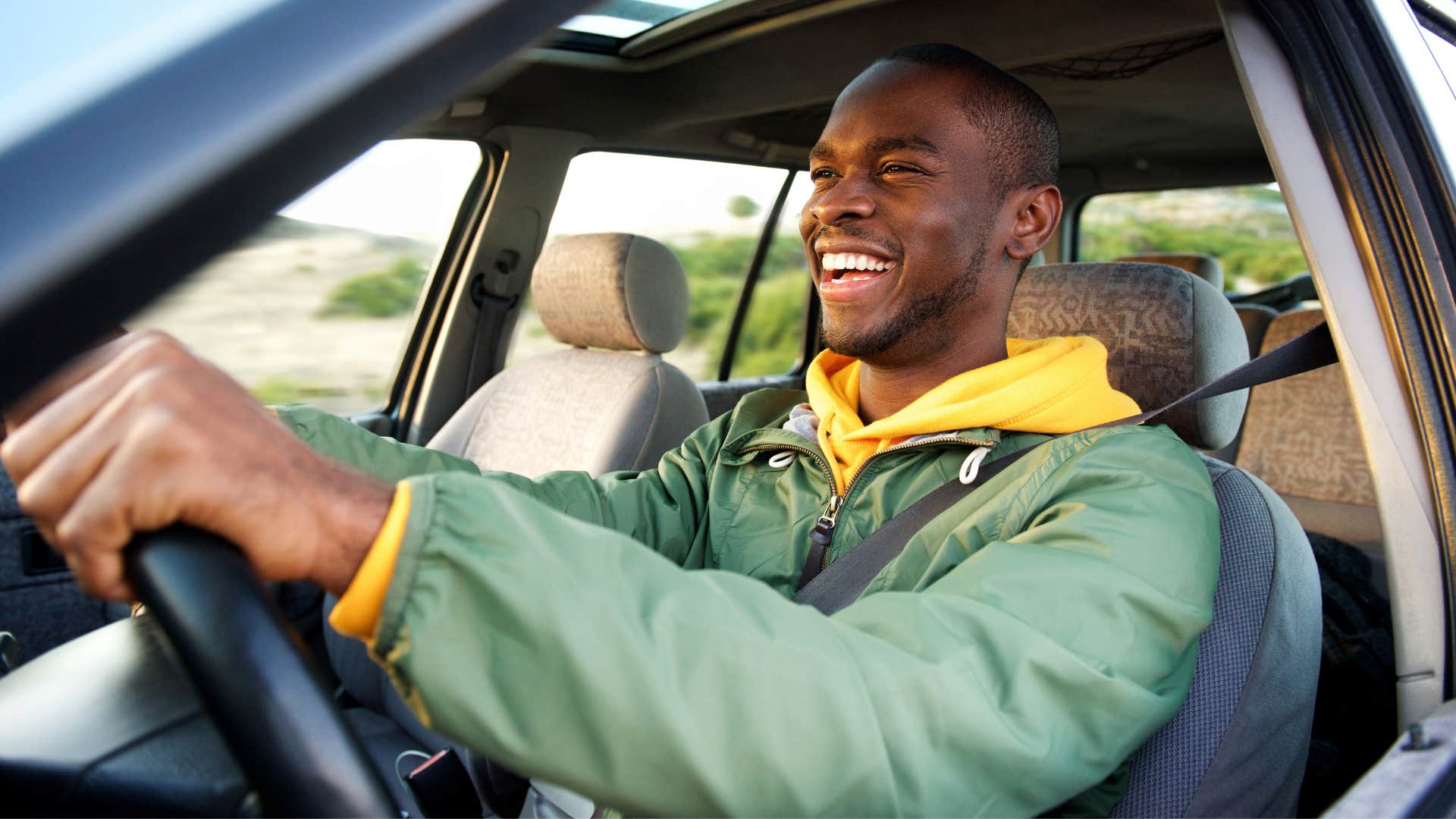 calm happy man not living in a state of urgency while driving