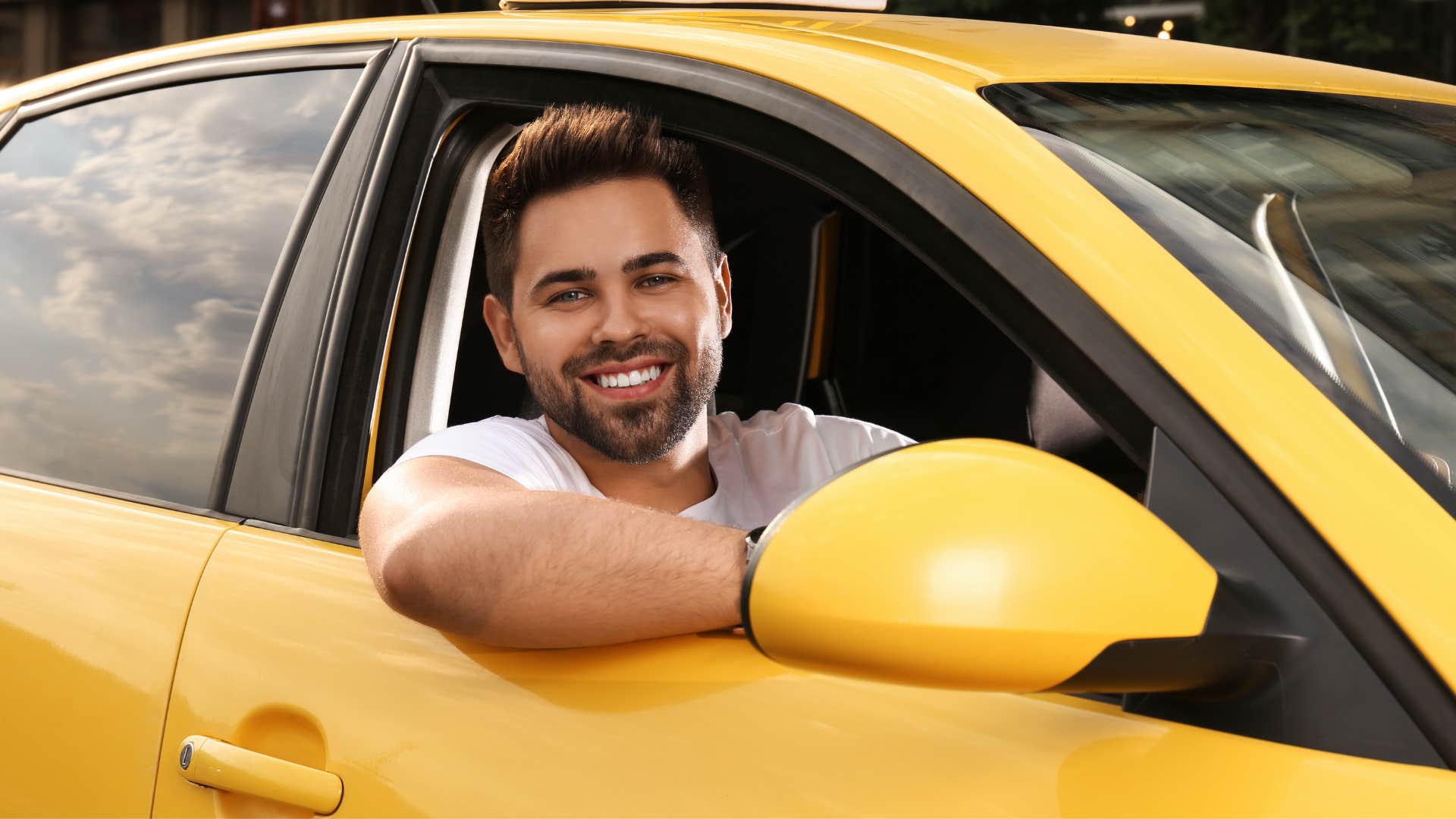 man who is mature driving a car