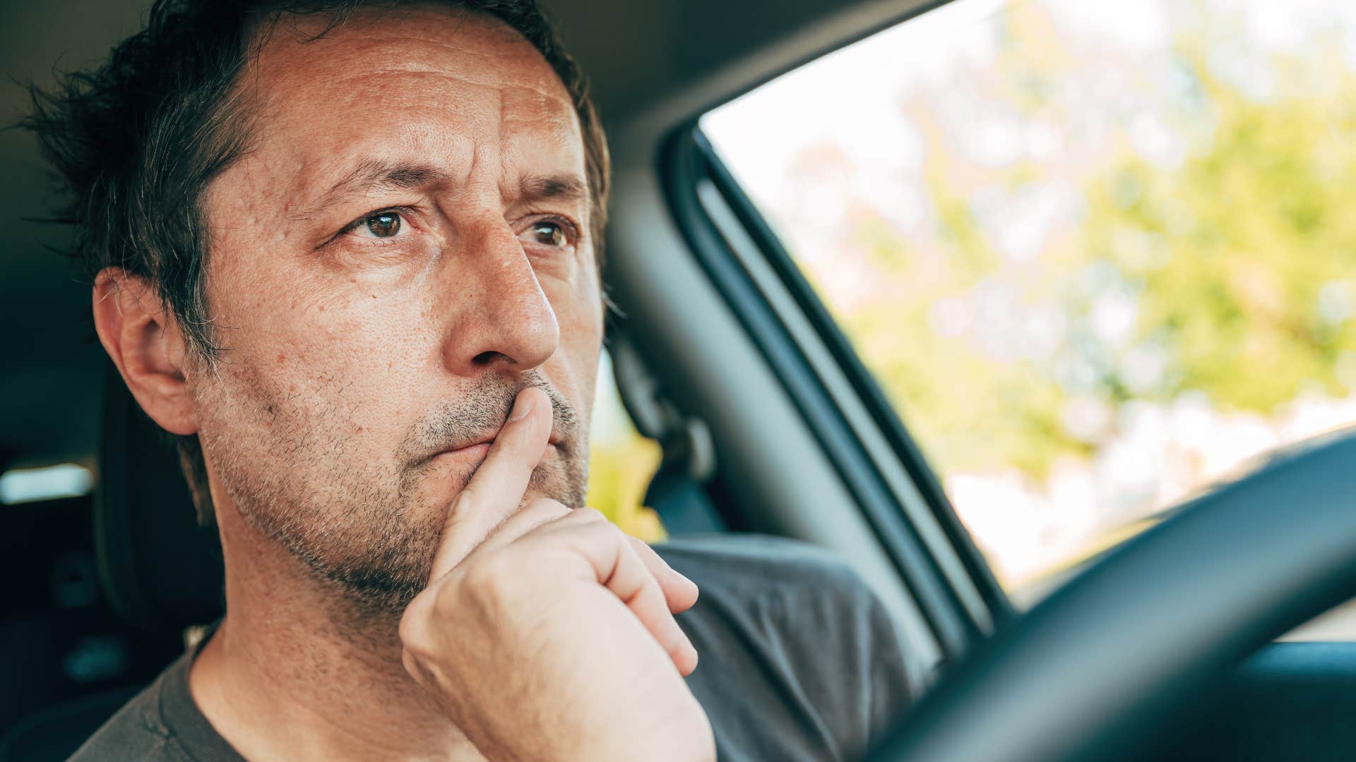 man with a strong moral compass driving his car