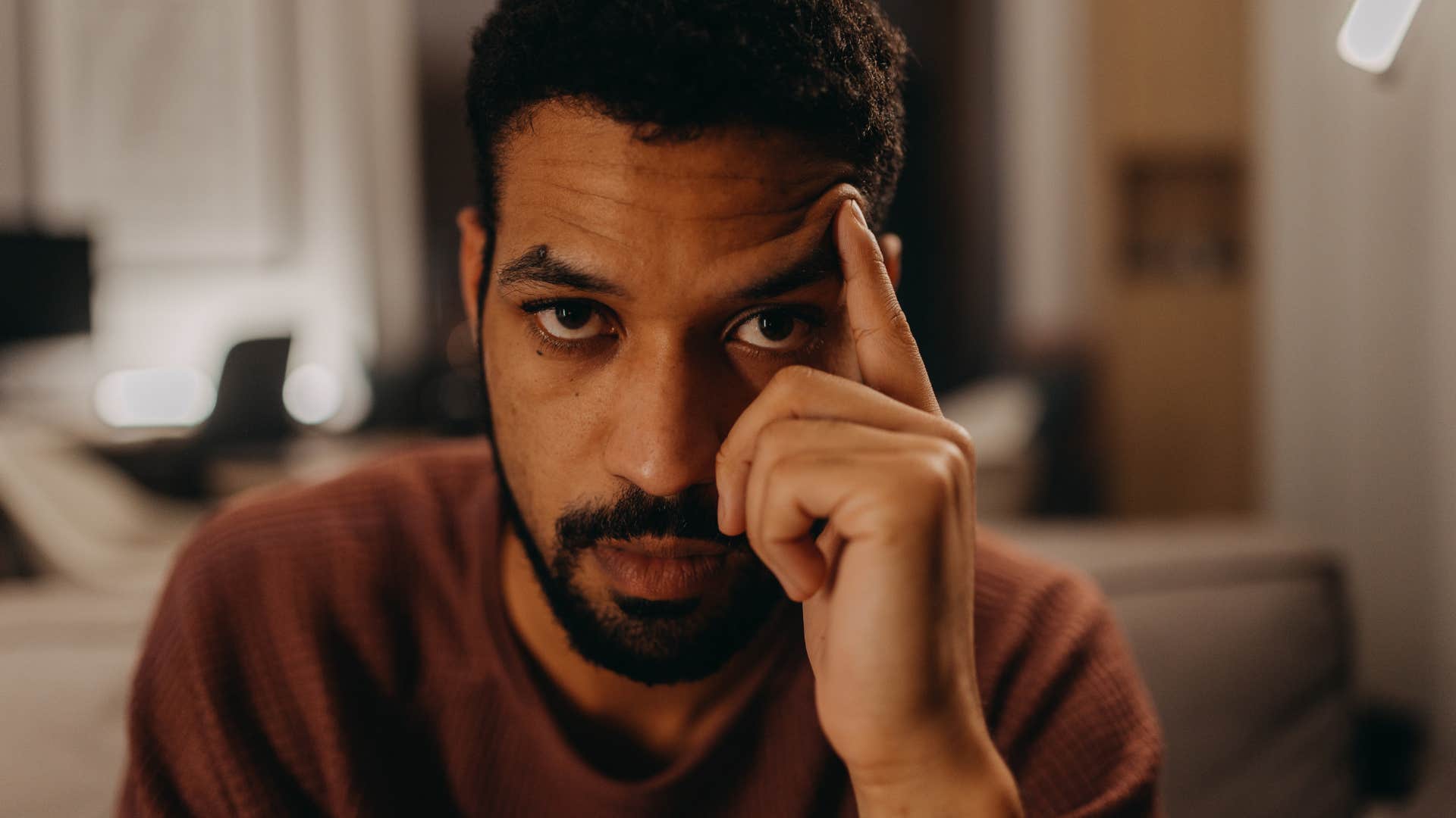 man who looks forward to bedtime holding himself to high standards stressed out