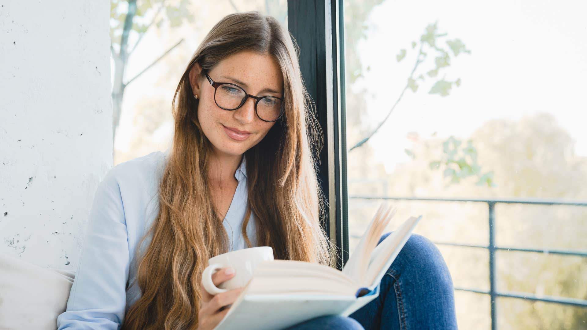 introverted woman who looks forward to bedtime all day reading at home