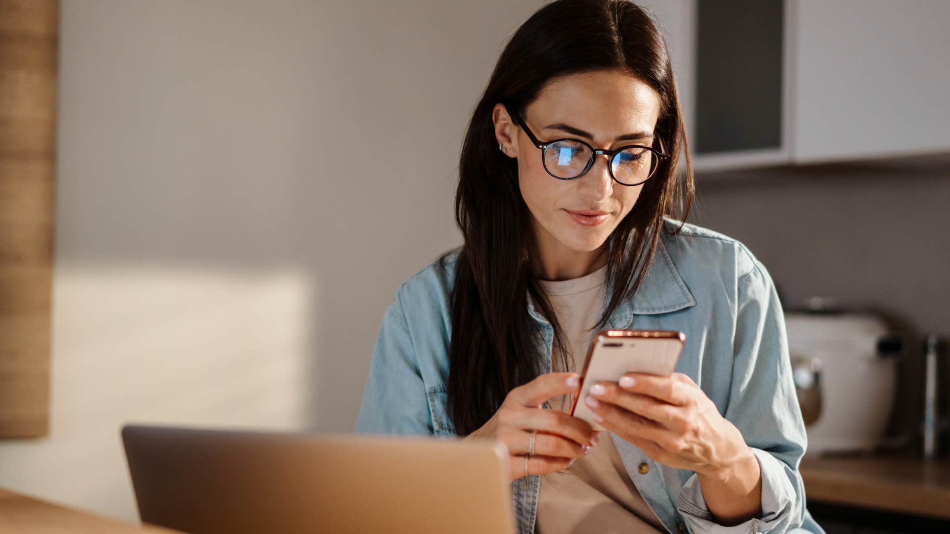 efficient woman looking at a menu on her phone at home