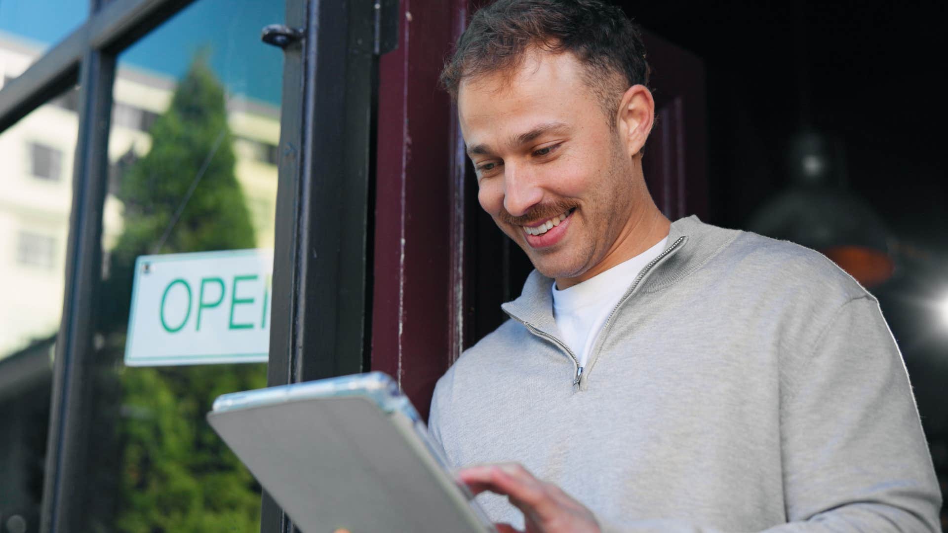 man who needs structure in his life looking at restaurant menu