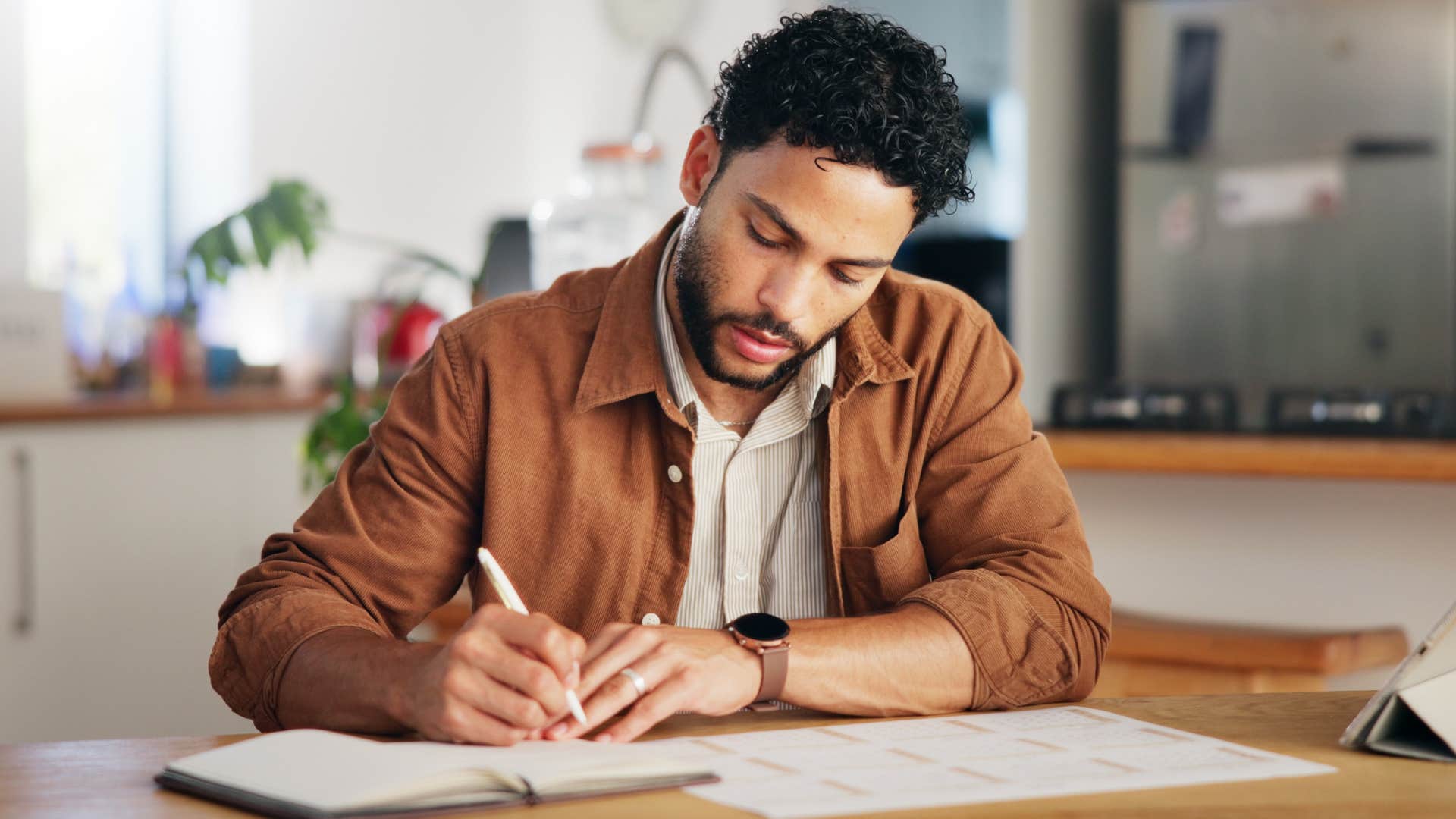 man who's a planner at heart looking at his calendar