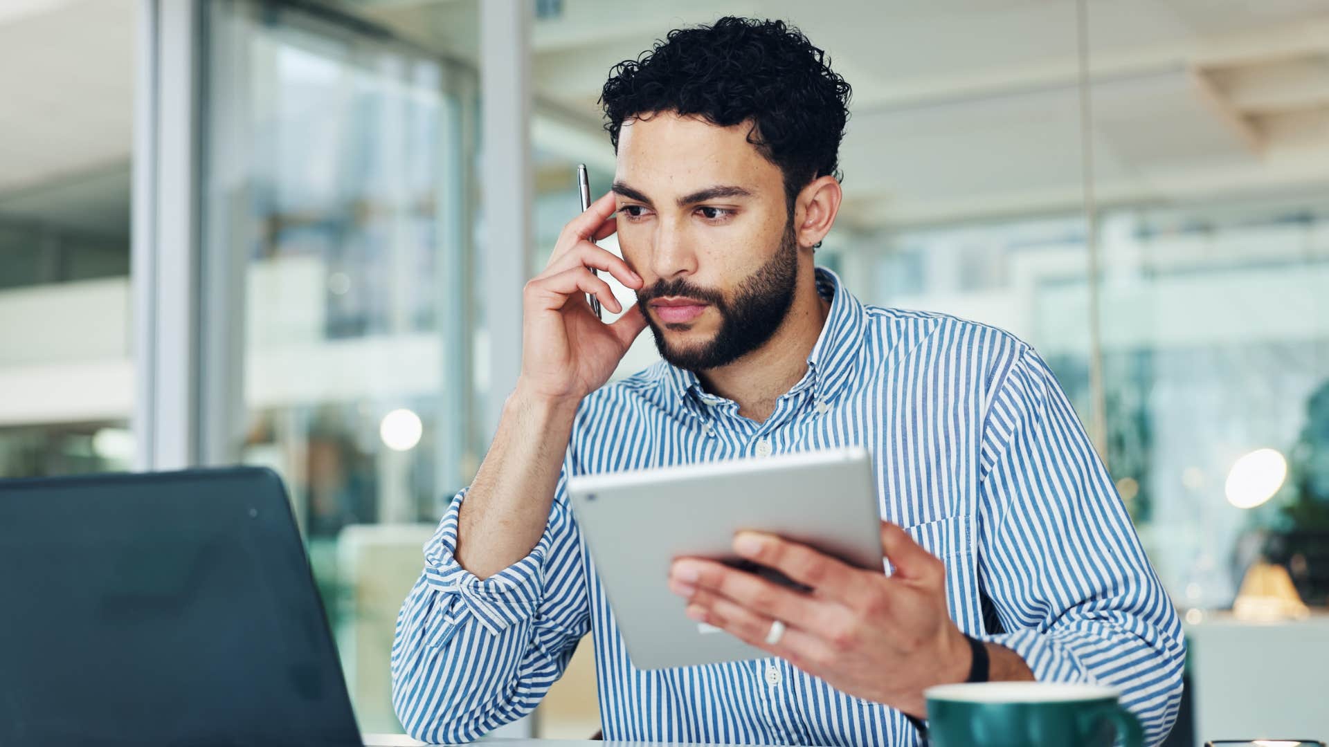 man working on tablet in office