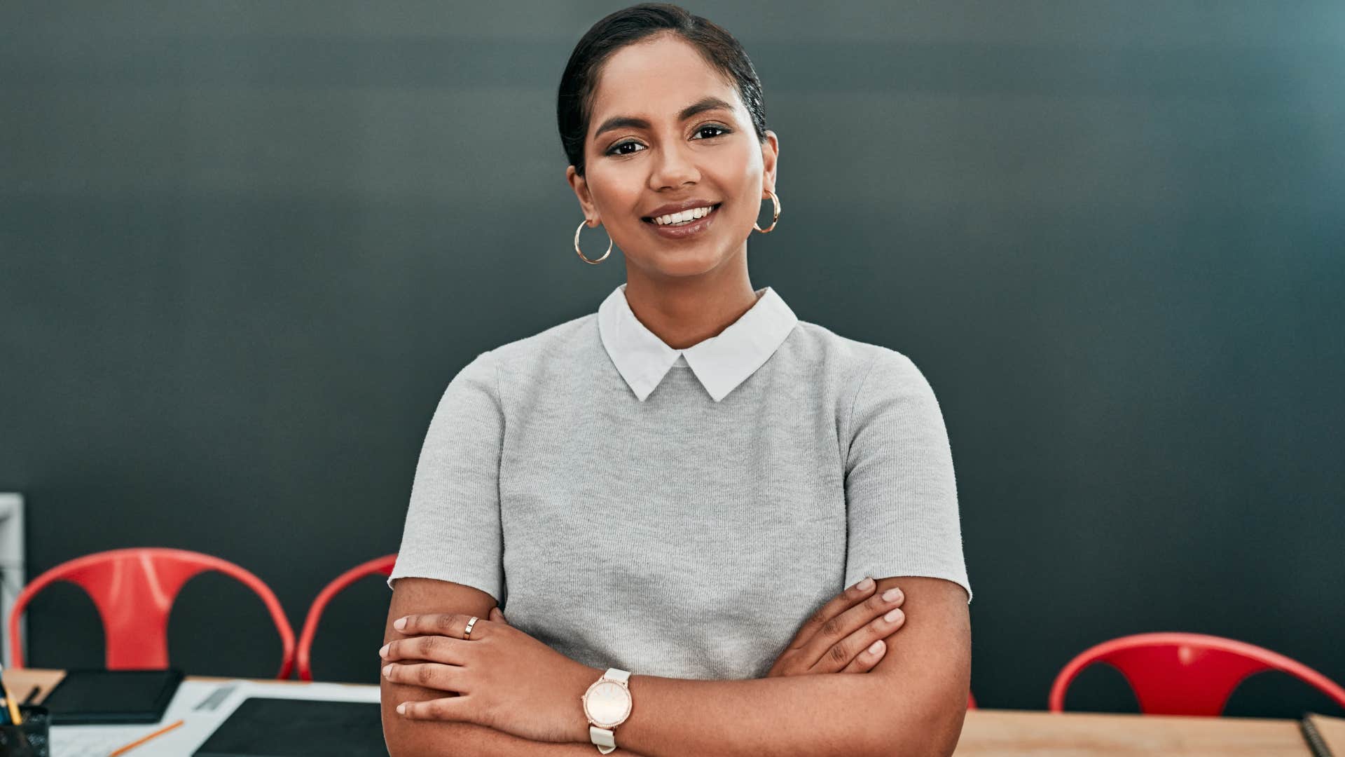 woman standing with arms crossed