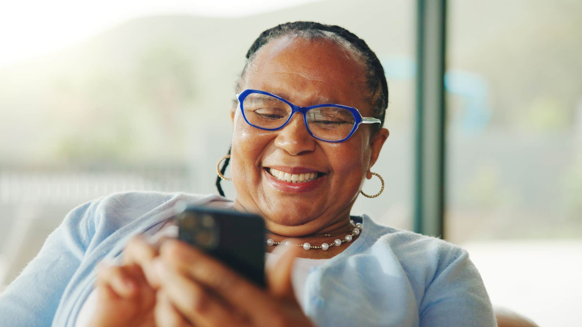 laughing woman embracing absurdity on her phone