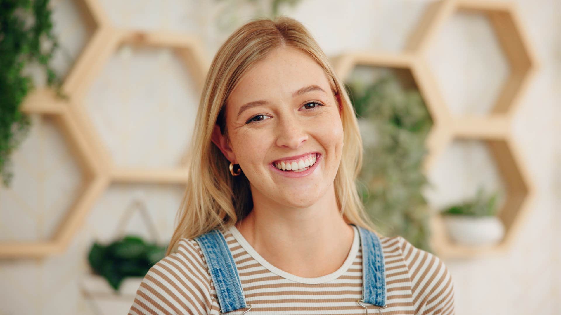 woman with a magnetic sense of humor laughing to herself