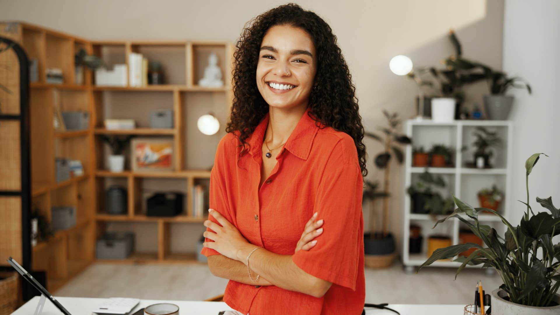 smiling woman turning mistakes into fun in her studio
