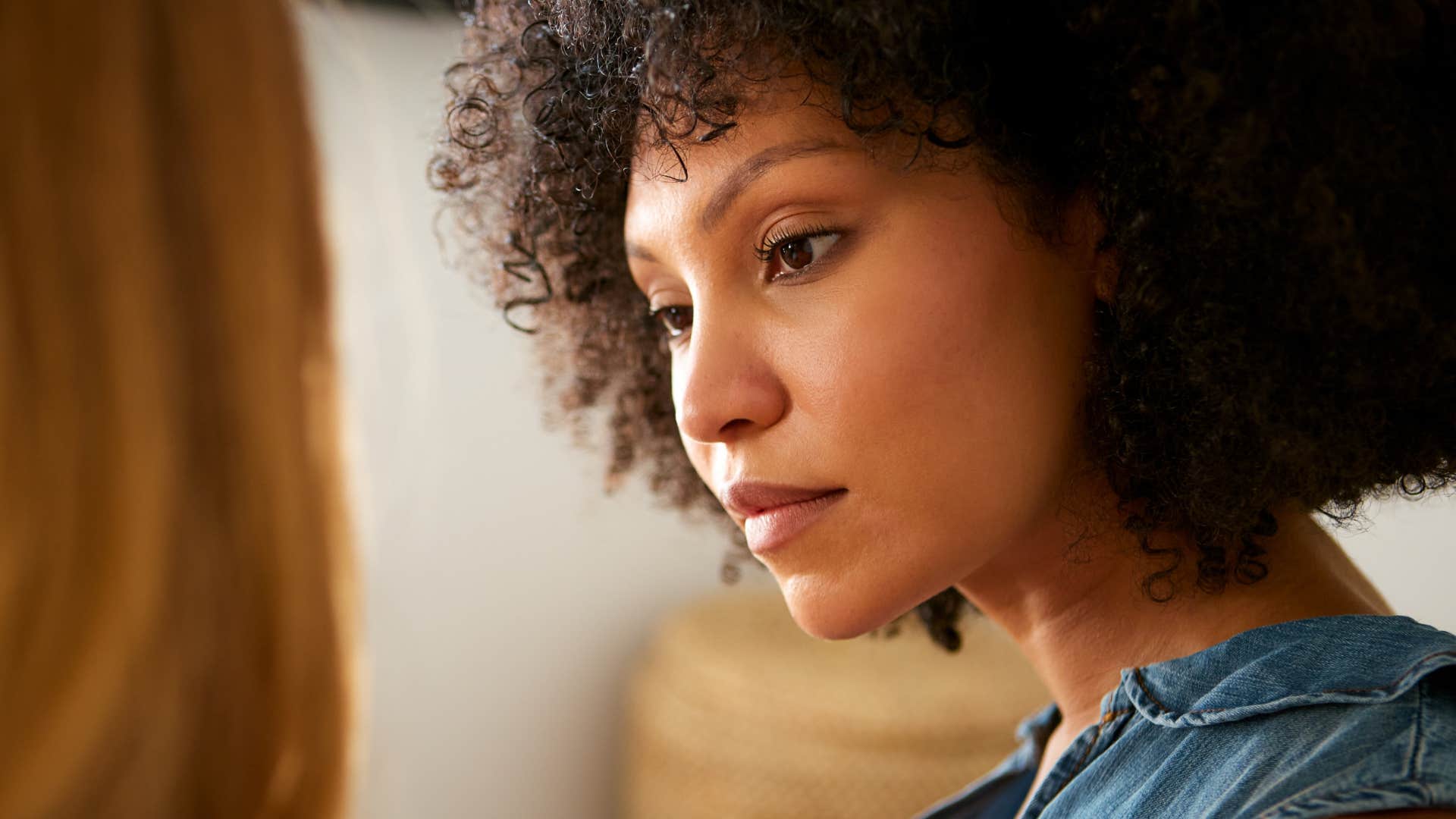 vulnerable woman listening to friend talk during conversation