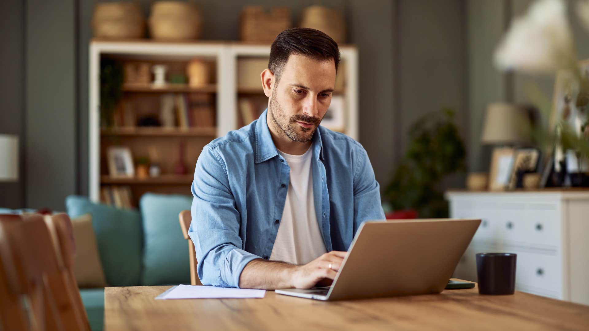 incredibly determined man working at home on little sleep