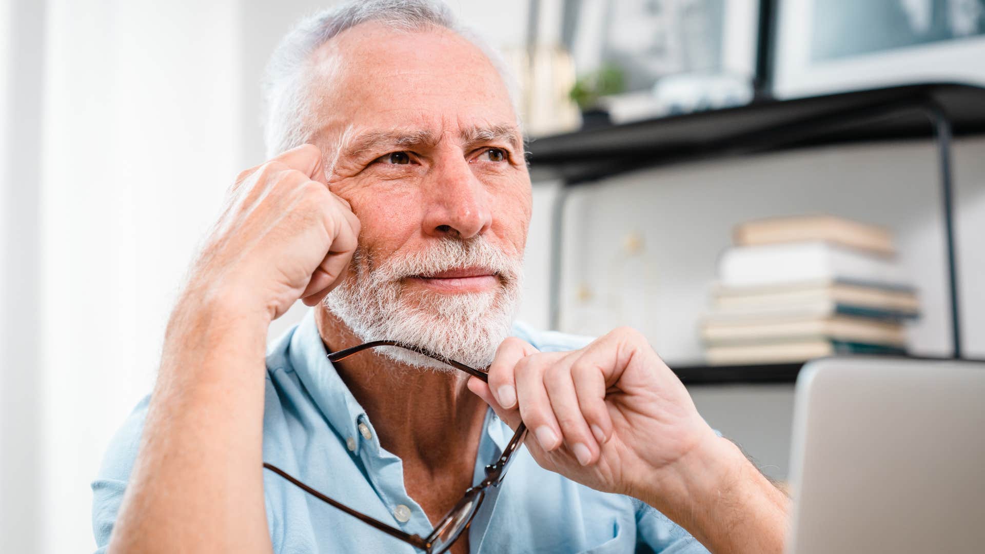 man protecting his alone time working at home