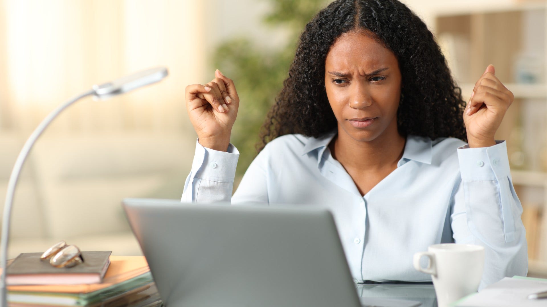 woman who remembers life before the internet pausing before trusting information online