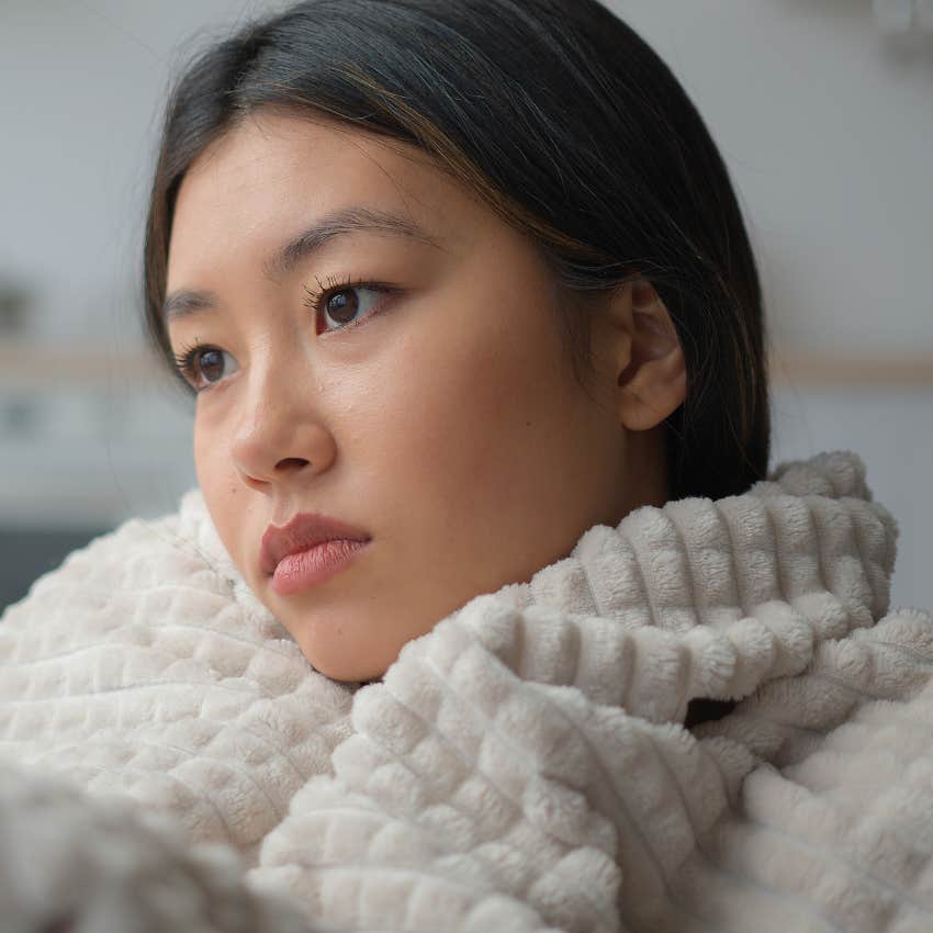 stressed woman whose nervous system is stuck in survival mode