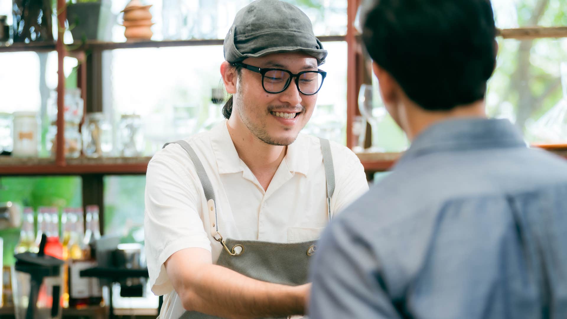 customer empathizing with barista at work