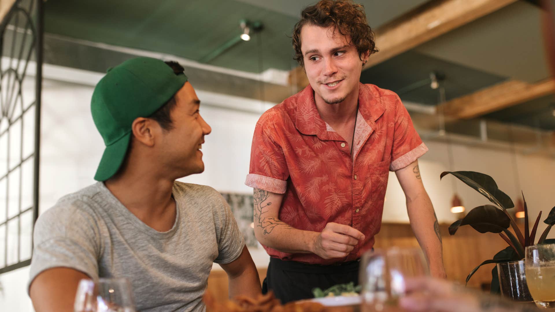customer who has great manners talking to a server