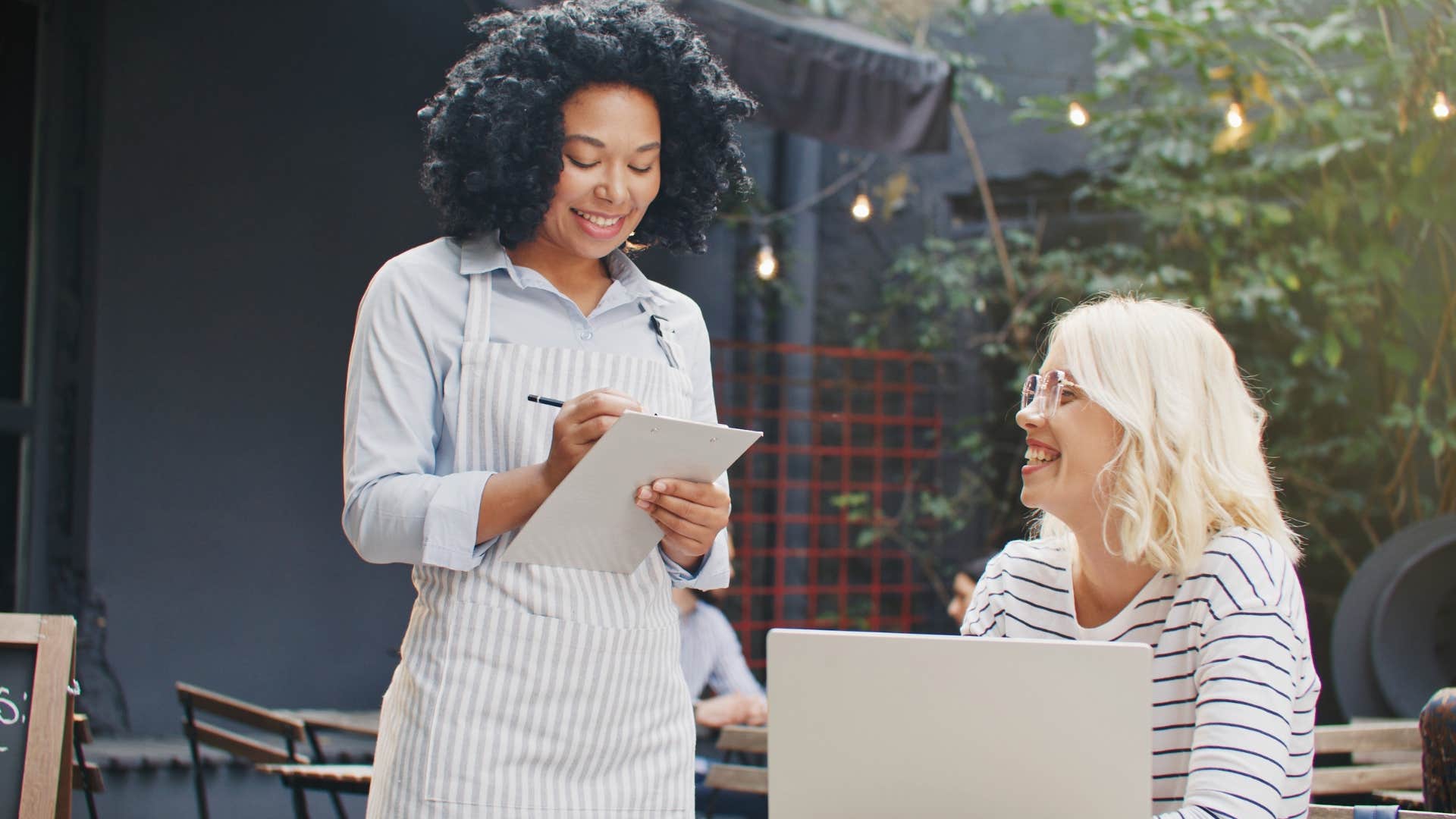humble woman talking to a server