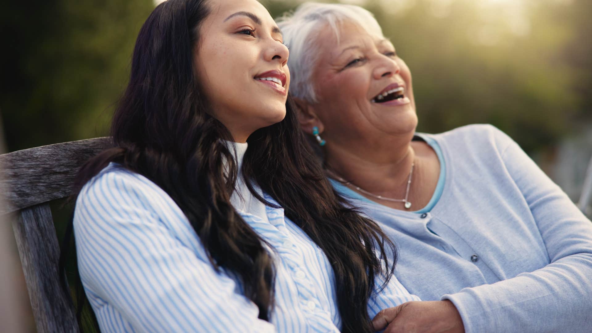 happy older person talks to younger person about past challenges