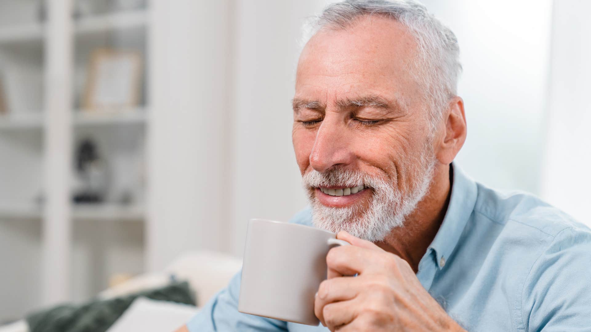 man who appreciates their solitude drinking tea at home