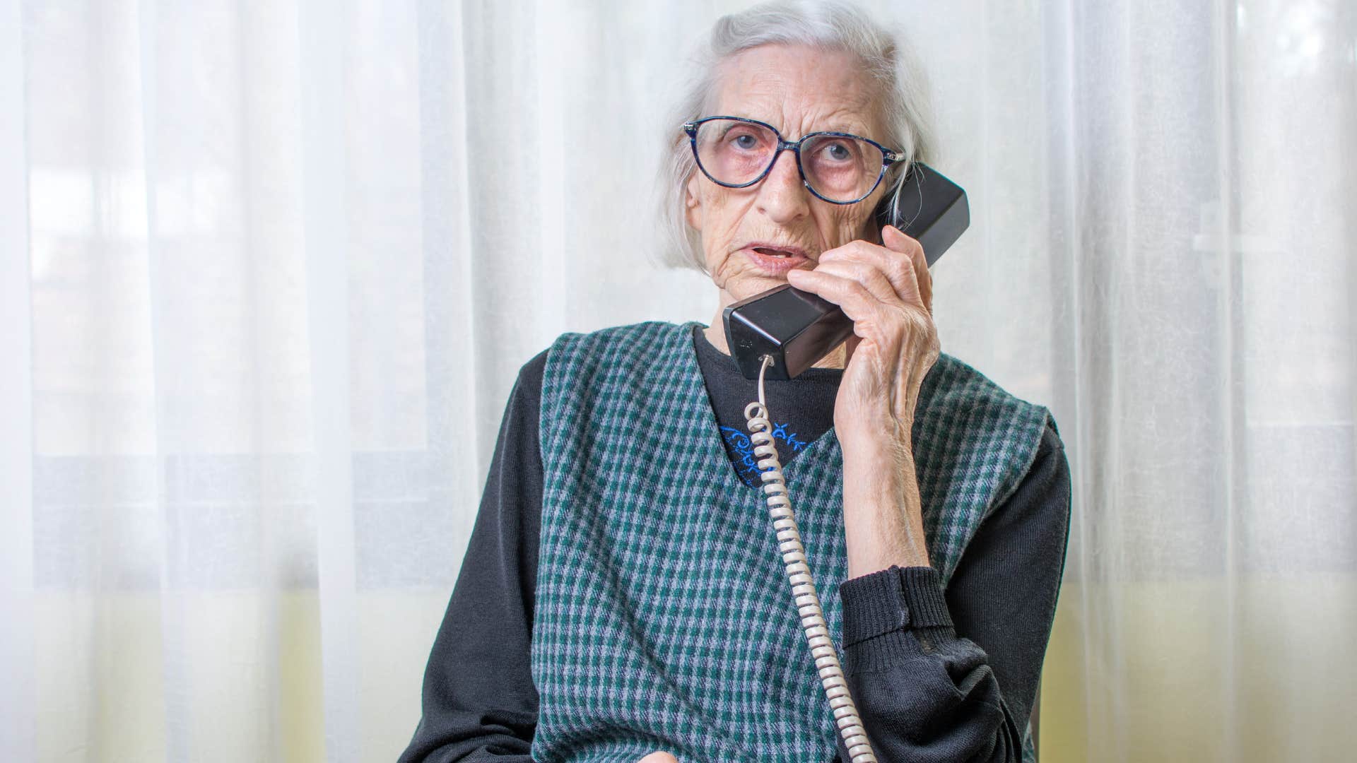 woman who's not performative talking on a landline