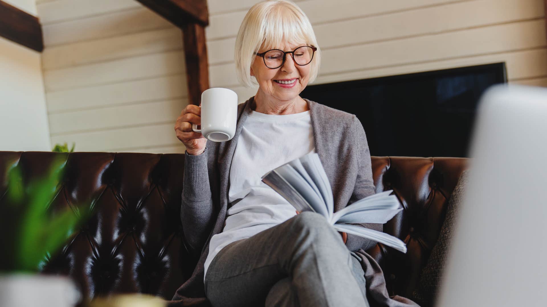 woman who sets strict boundaries with phone reading a book