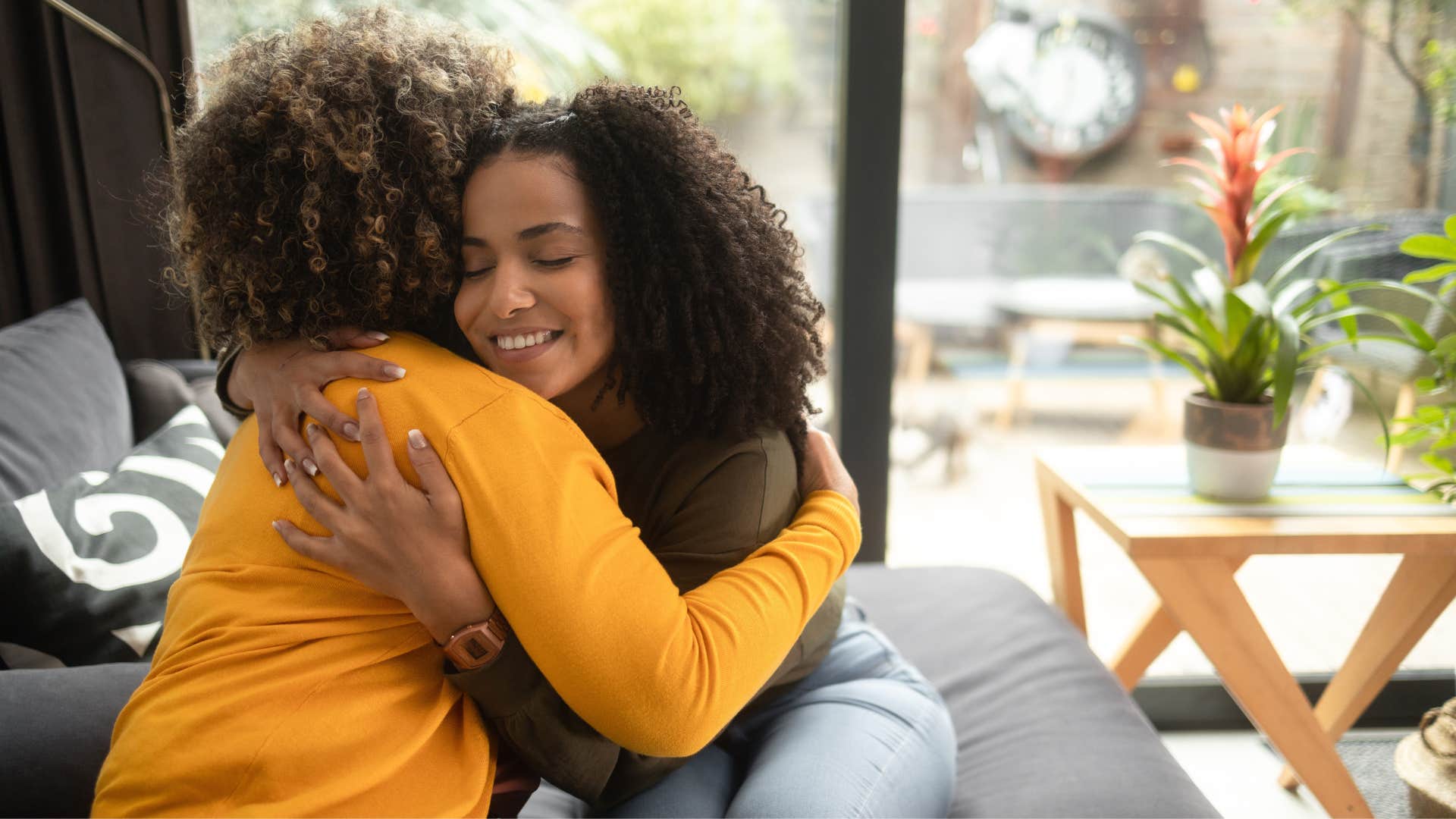 woman feeling comfortable with vulnerability hugging friend
