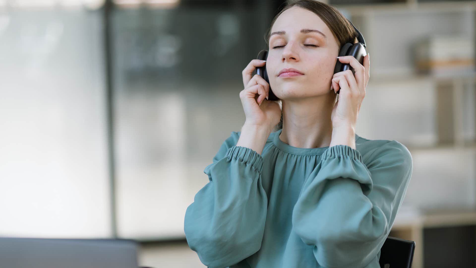 woman who appreciates slowness and intentionality listening to music calming herself