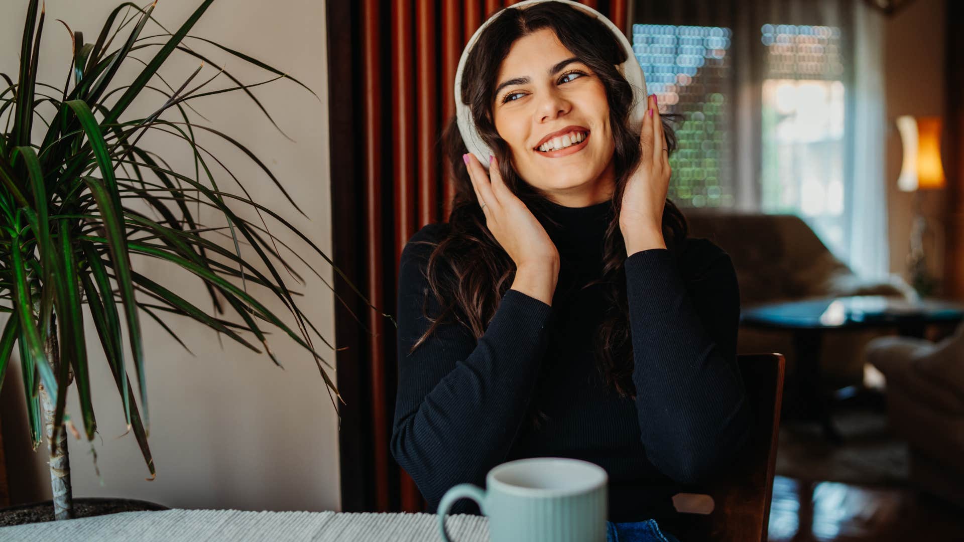 focused woman listening to music she loved in her 20s