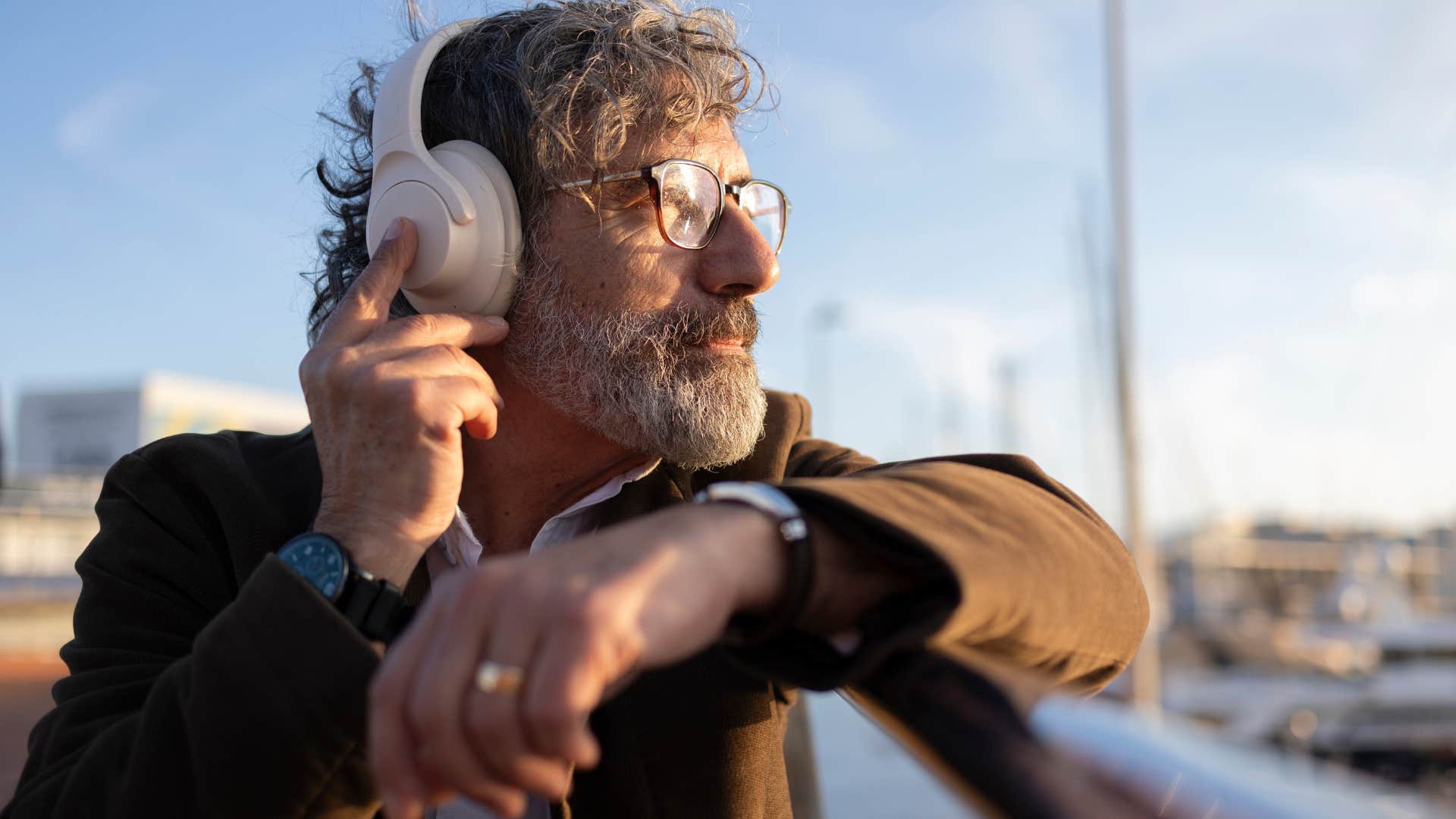 incredibly nostalgic man listening to music outside