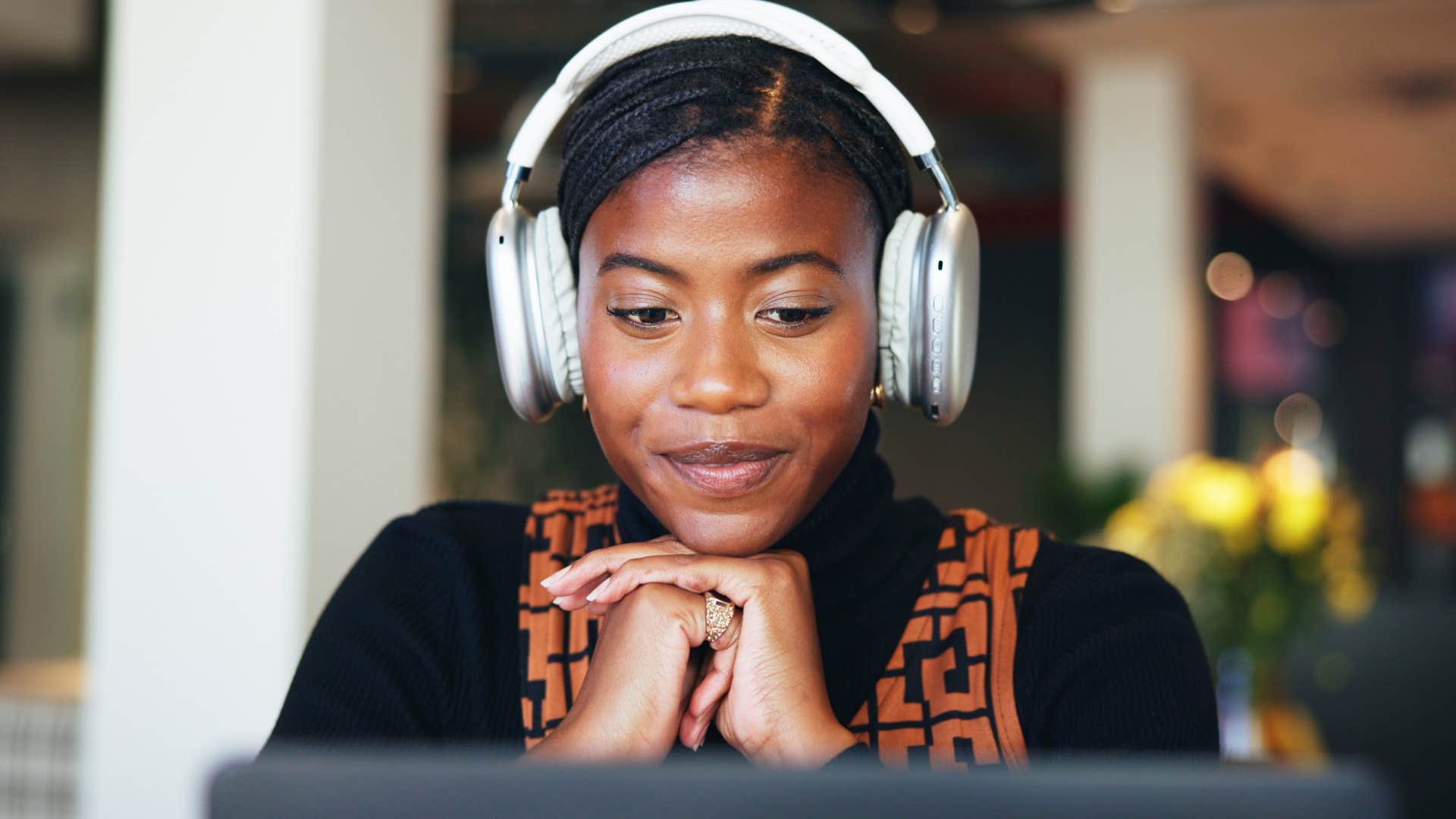 Woman who appreciates busyness listening to 80s and 90s music