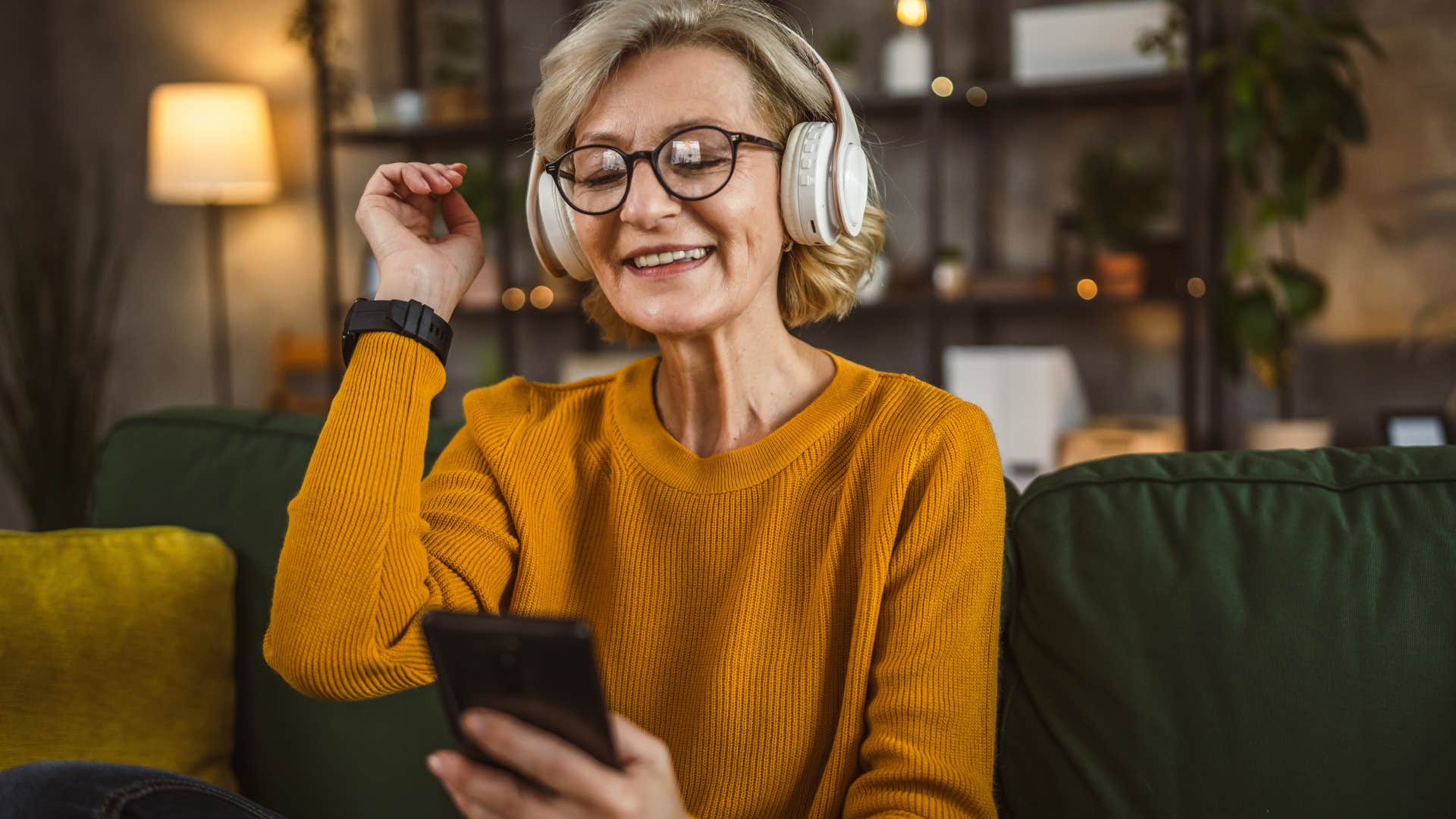 Woman who chases familiarity instead of trends listening to 80s and 90s music