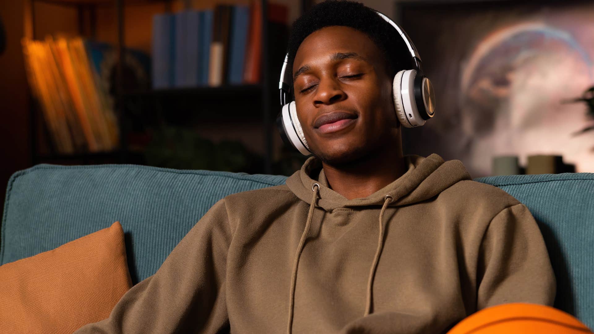 Man who's content with where he is listening to 80s and 90s music