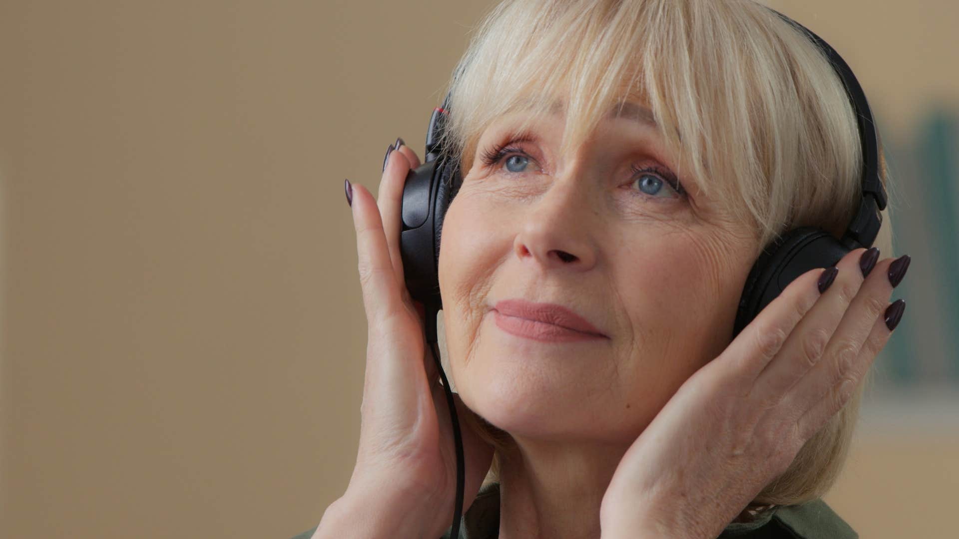 Woman who finds comfort in certainty listening to 80s and 90s music