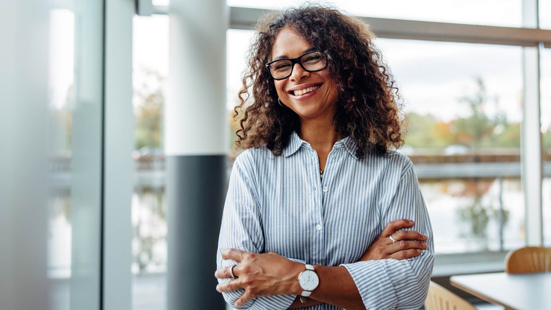 Happy person stands confidently showing they let go of negativity