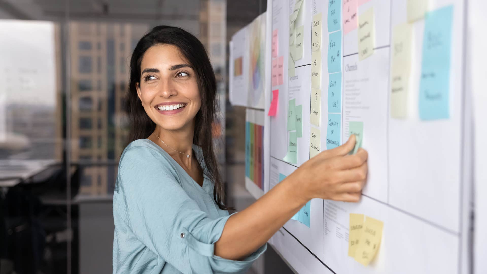 woman appreciating structures and systems planning a calendar
