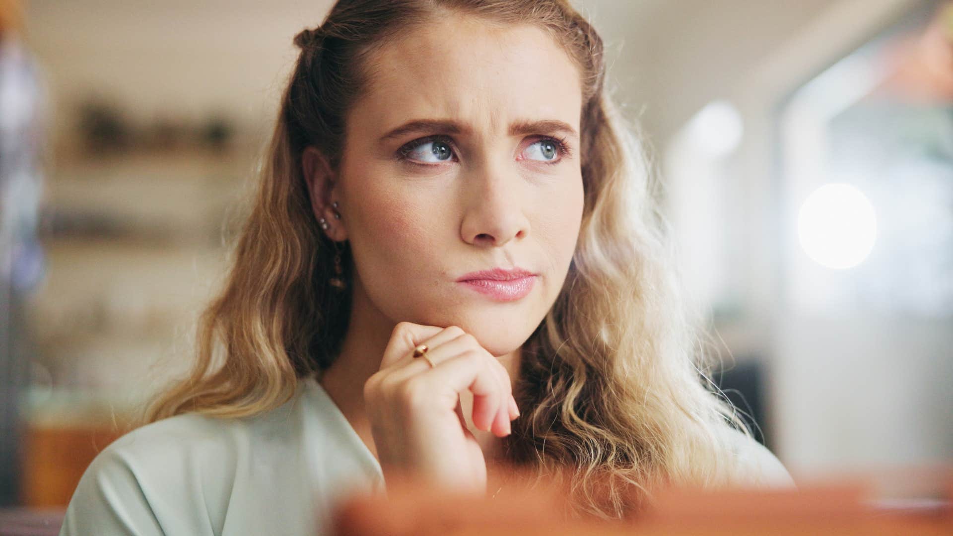 practical woman thinking of solutions at home