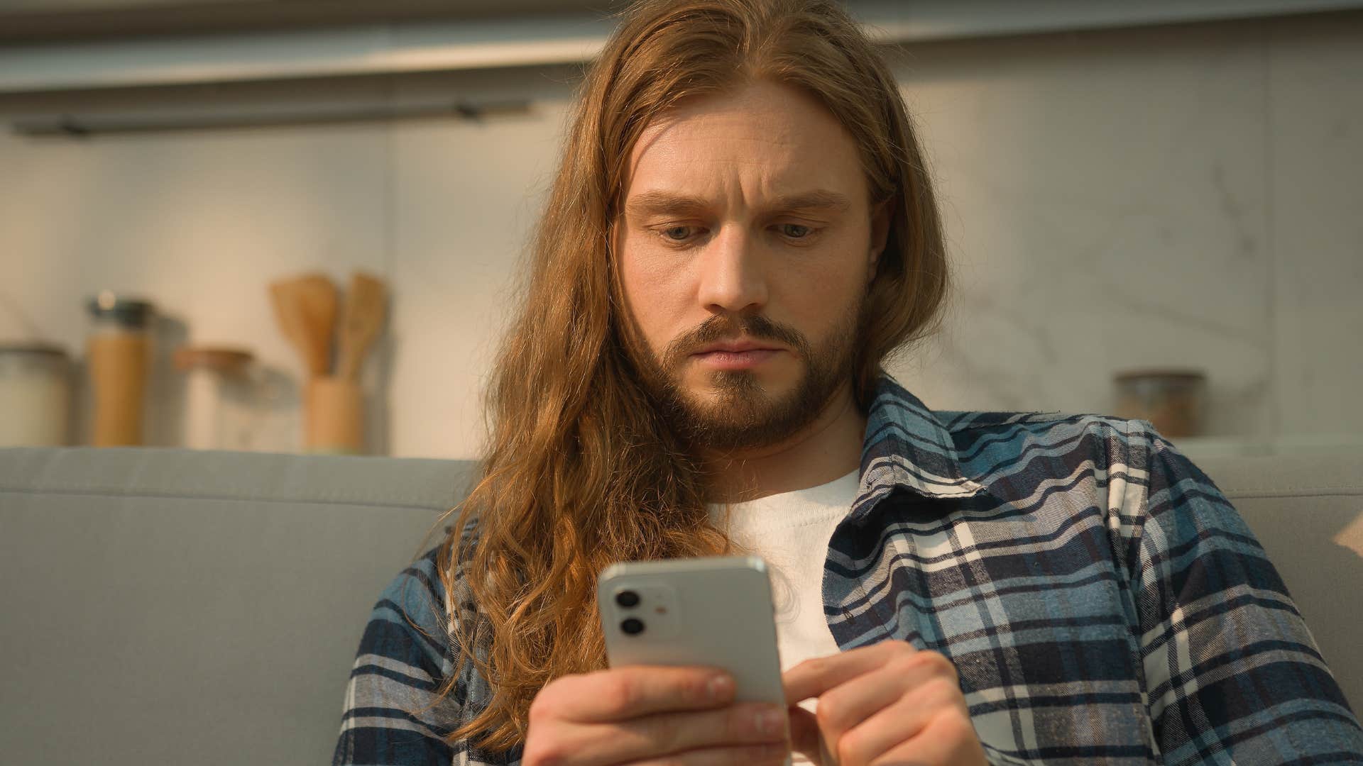 man following every trend he sees on his phone