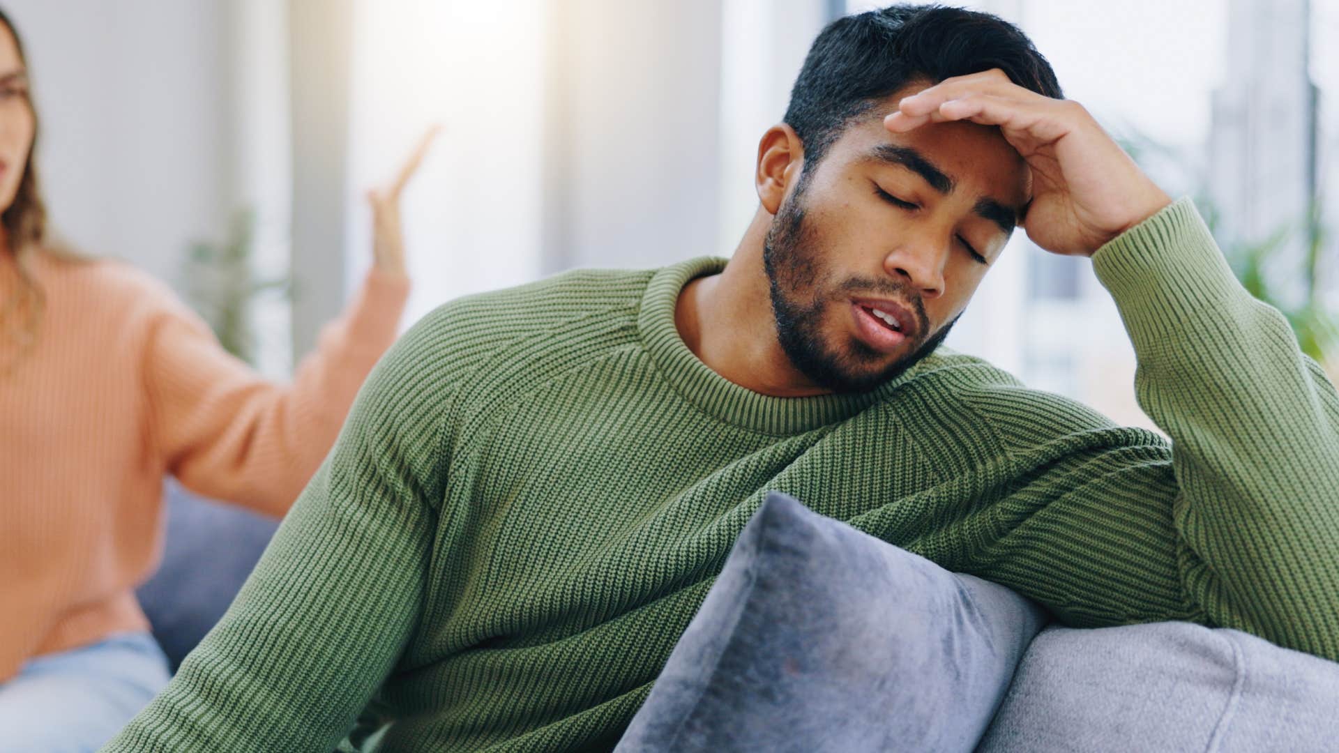 man hiding his emotions and concerns from his partner