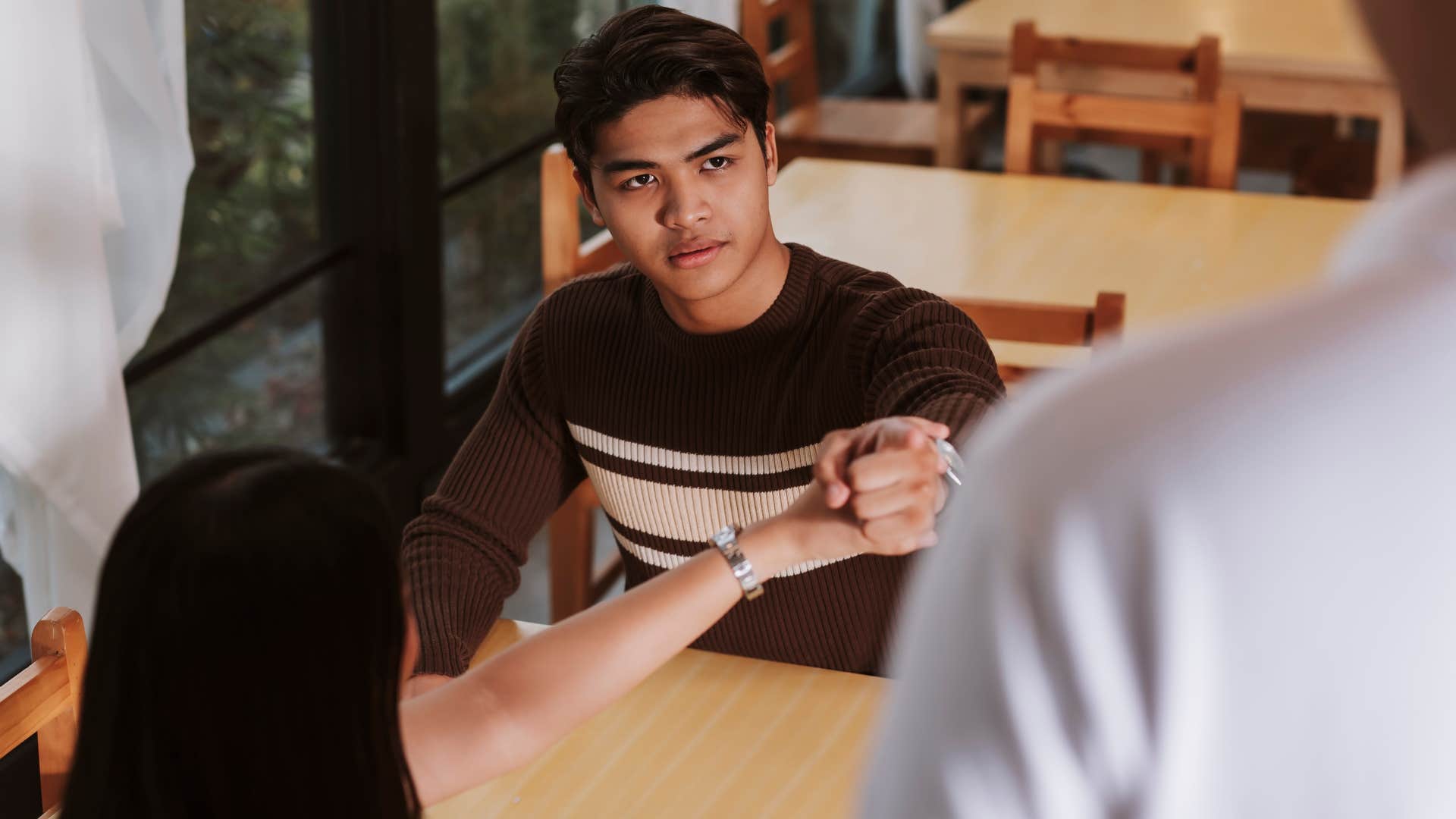 rude man treating service workers poorly at a restaurant