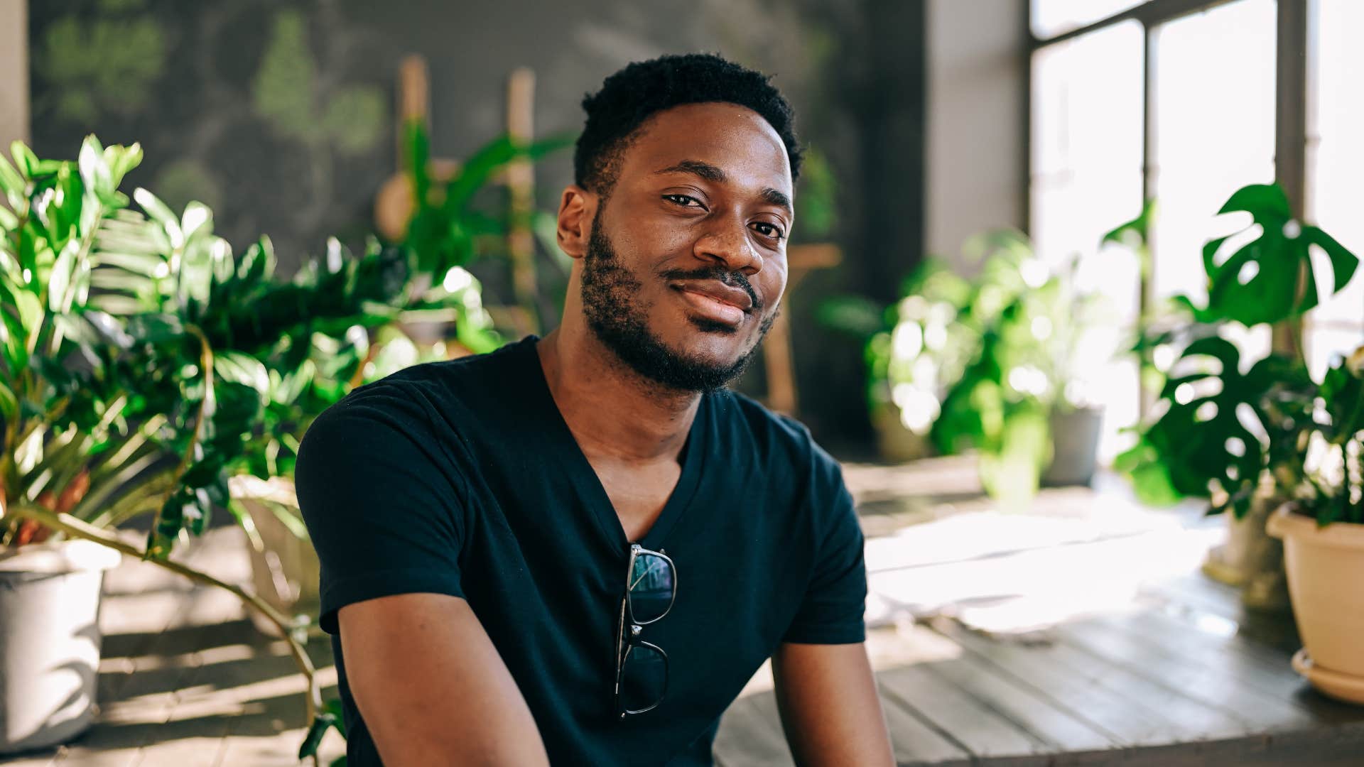 confident man comfortable with solitude sitting in his studio